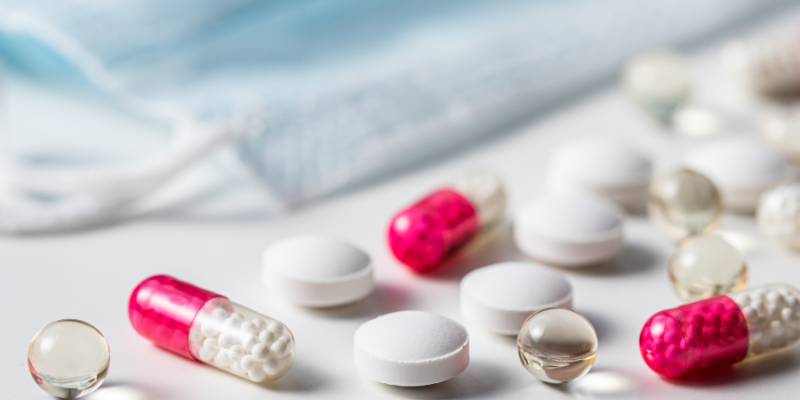 Various shapes of supplements spilled onto table