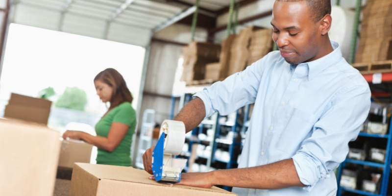 employees putting parts of orders together to ship during kitting services
