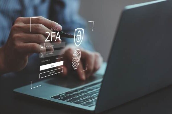 man making a payment on his laptop that is requiring 2 factor authentication to prevent fraud