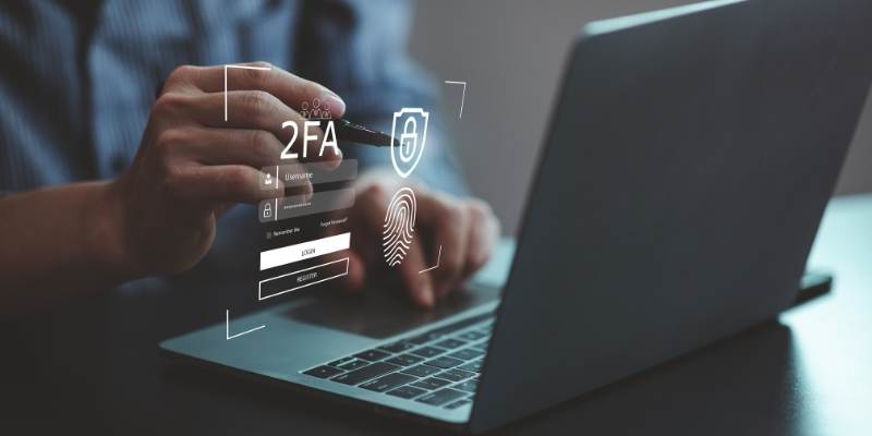 man making a payment on his laptop that is requiring 2 factor authentication to prevent fraud