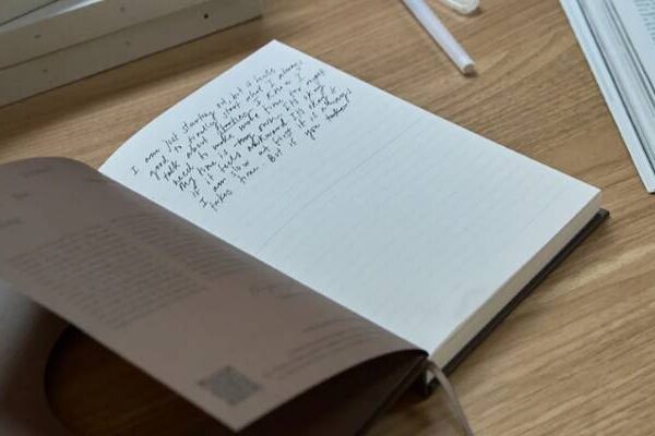 open journal with some writing in it made by wilde house paper